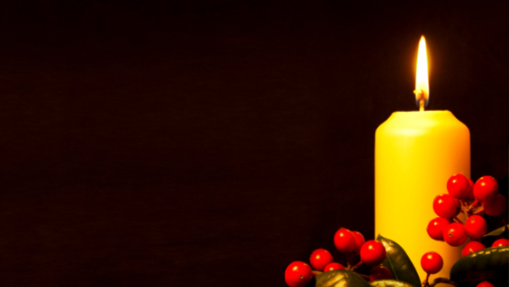 A lit Christmas candle